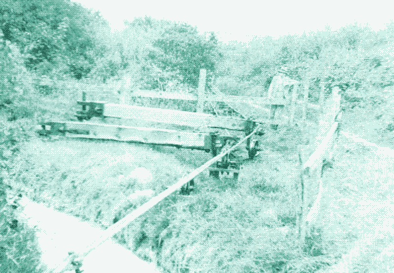 Two lines of flat rods at Carloggas in 1938. These rods were led round a small angle by single-arm fend-off bobs, whose outer ends had a small wheel on a curved rail. Image: &ldquo;Steam engines and waterwheels: a pictorial study of some early mining machines&rdquo;.