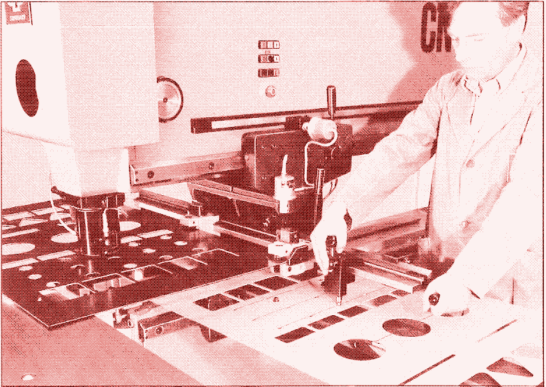 Manually operated punching machine.