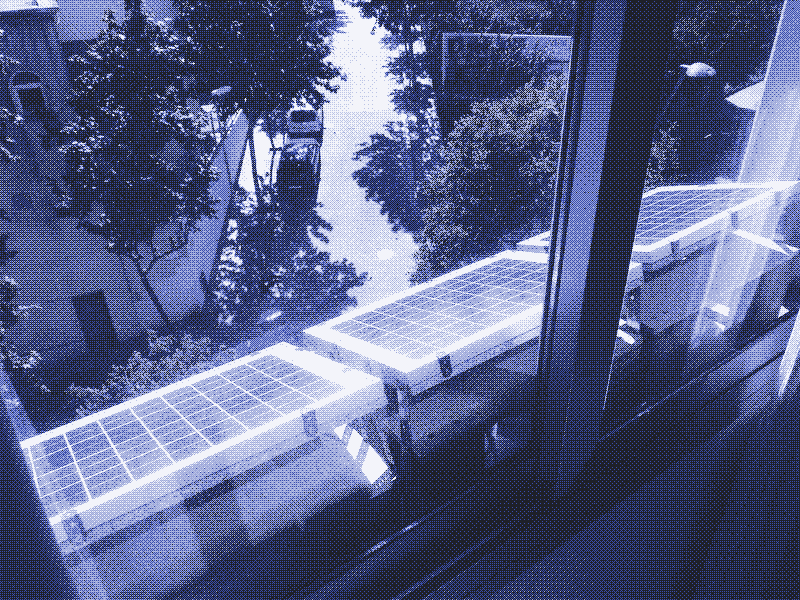 Image: three 10W solar panels on a window sill. Photo by Kris De Decker.