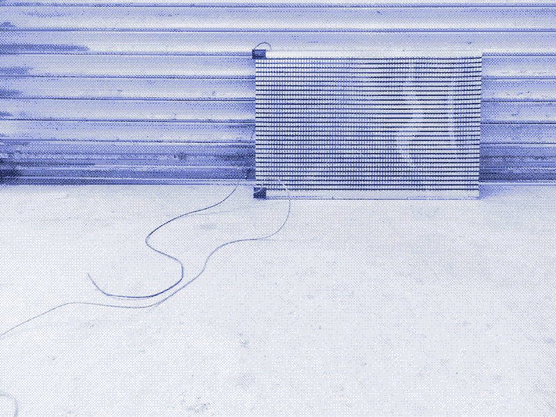 Image: The infrared heating foil, screwed against a thin wood board, ready to be fixed below the table surface. Photo: Kris De Decker.