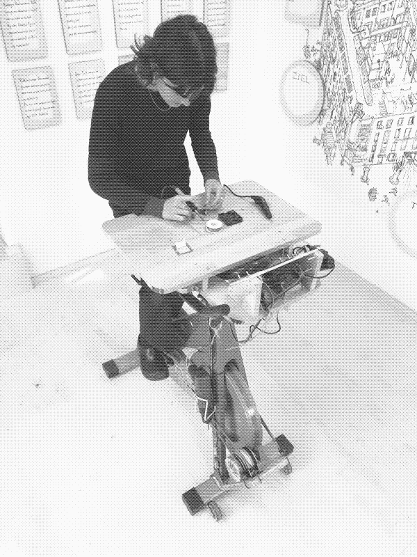 Johanna is soldering with pedal power. Photo by Marie Verdeil.