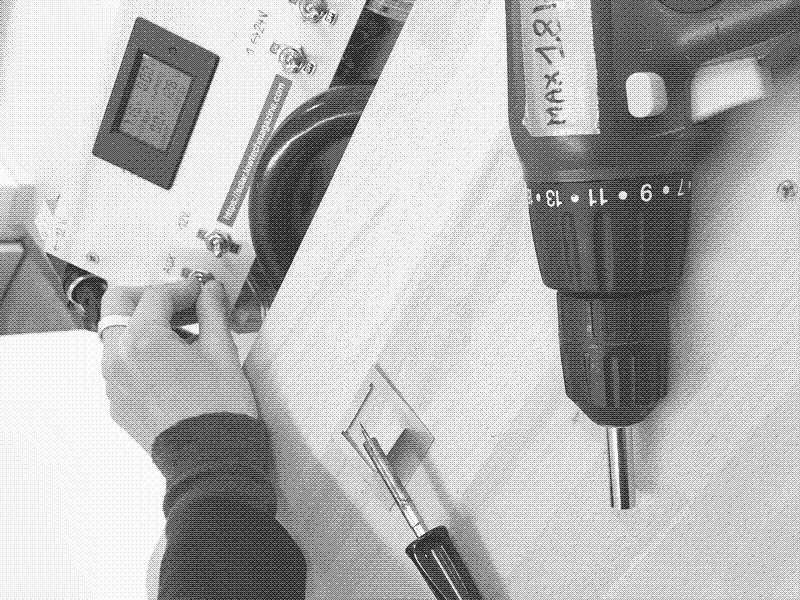 Controlling the power output with the dashboard. Niki hacked the drill to by pass the broken battery. Photo by Marie Verdeil.