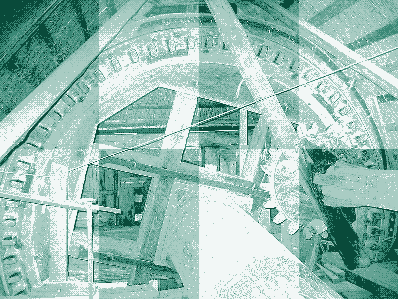 Image : Les engrenages en bois d’un moulin à vent.